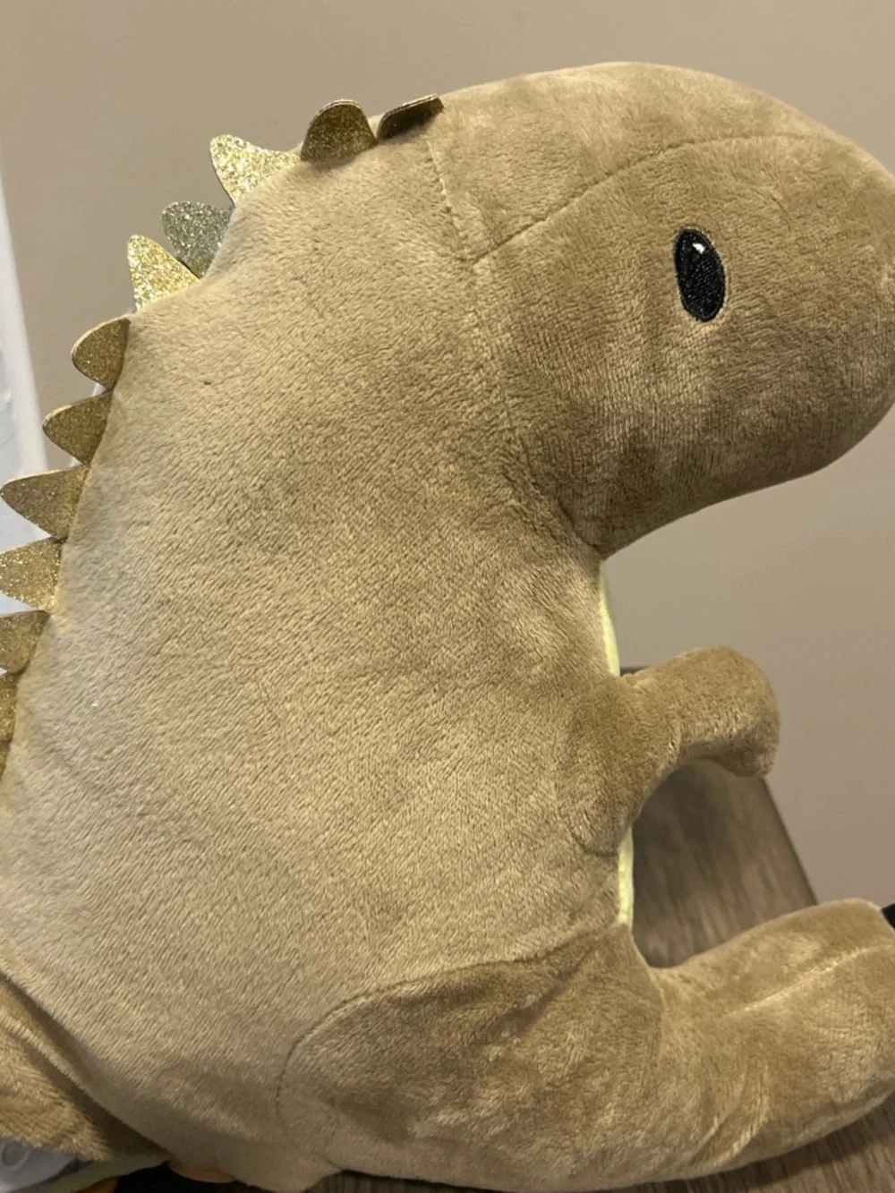 Dinosaur plush with pocket for storing treasures